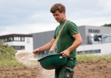 Employee works on the field